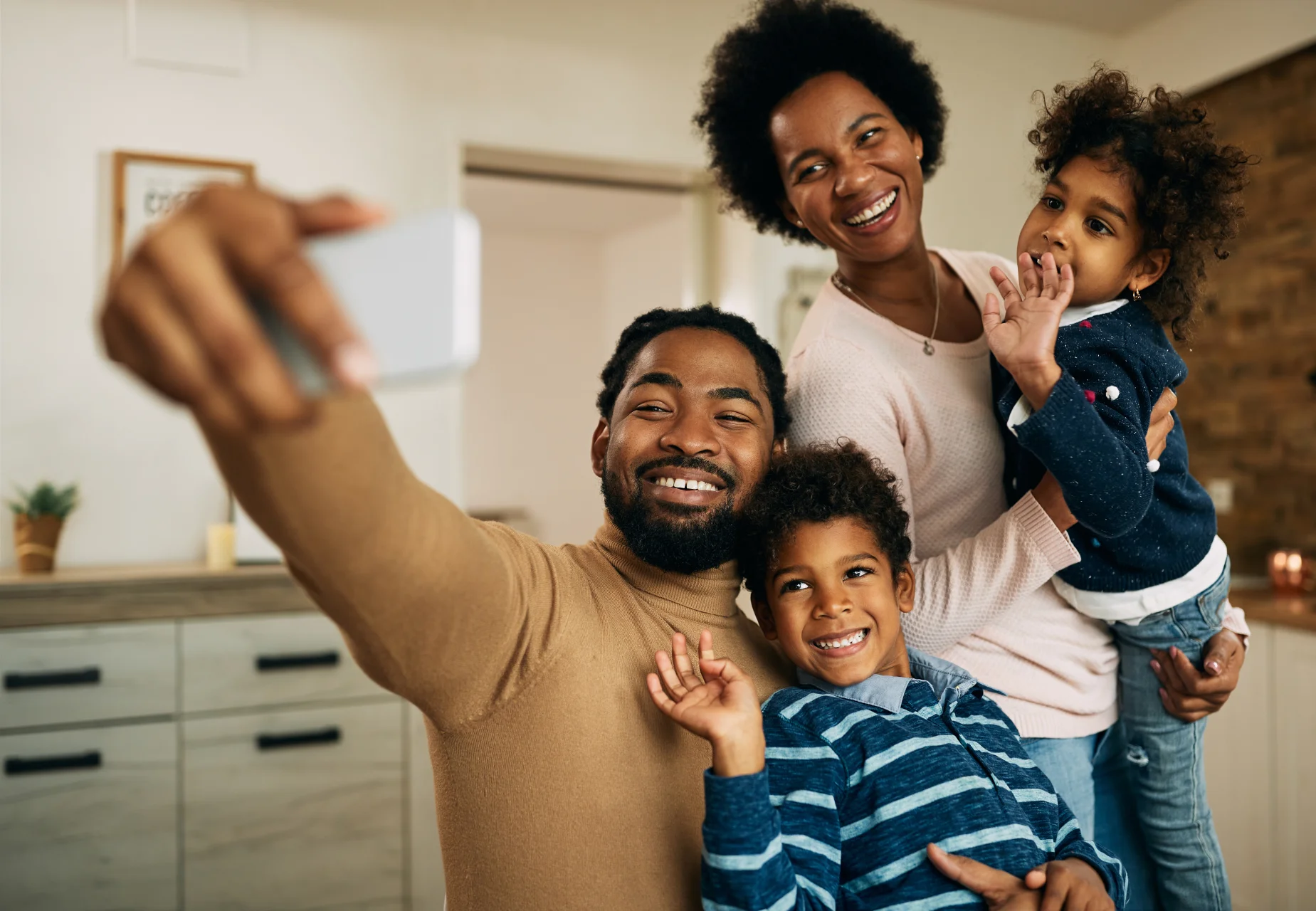 Smiling family in their new home